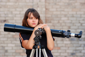 Teen girl and telescope, Near Kiev,Ukraine